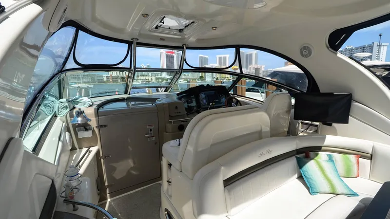 Ma Folie III Yacht Photos Pics Interior of 2007 Sea Ray 40 Sundancer yacht with modern helm and seating.