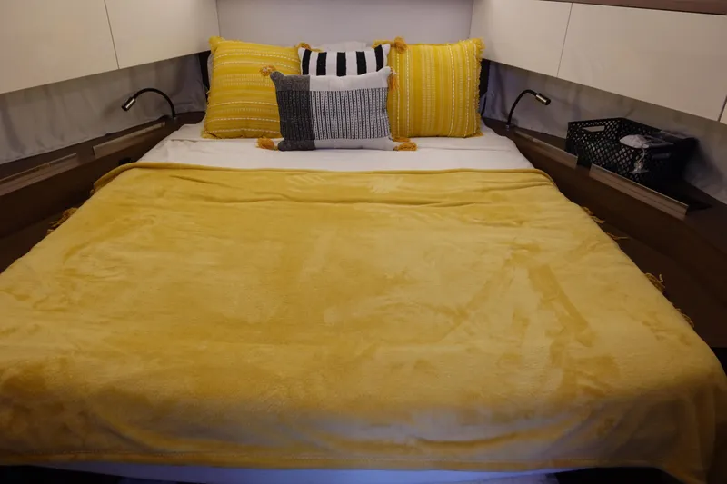 Somedays Here Yacht Photos Pics Cozy bedroom in 2021 Jeanneau NC 37 yacht with yellow bedding and pillows.