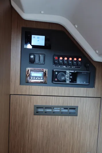 Somedays Here Yacht Photos Pics Control panel of a 2021 Jeanneau NC 37 boat with switches and display.