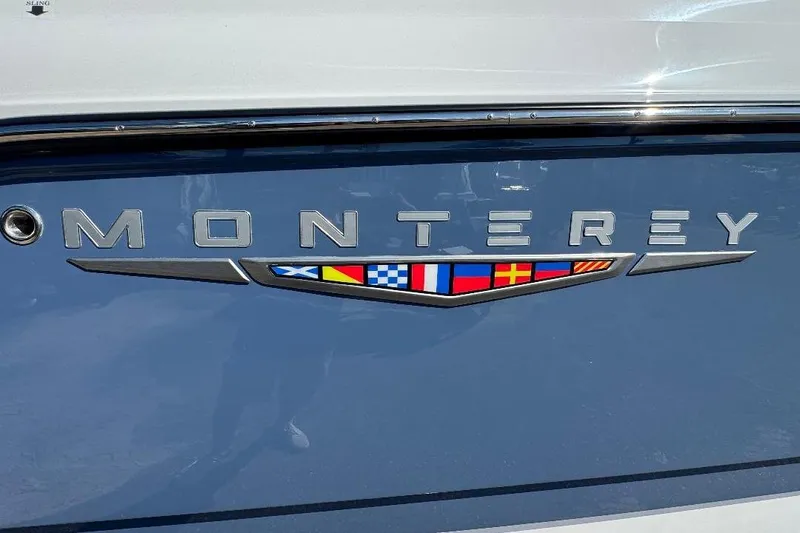  Yacht Photos Pics Monterey Elite 30 OB 2026 logo with nautical flags on blue background.