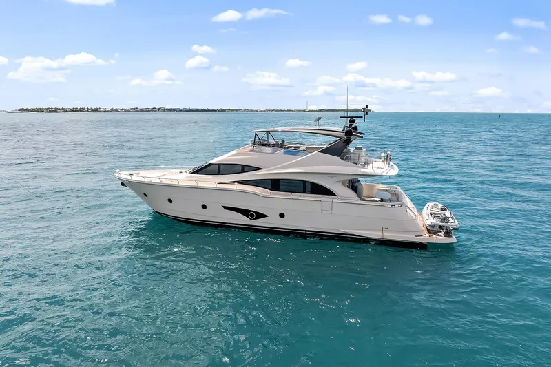  Yacht Photos Pics Luxury 2016 Marquis 720 Fly Bridge yacht cruising on open sea.