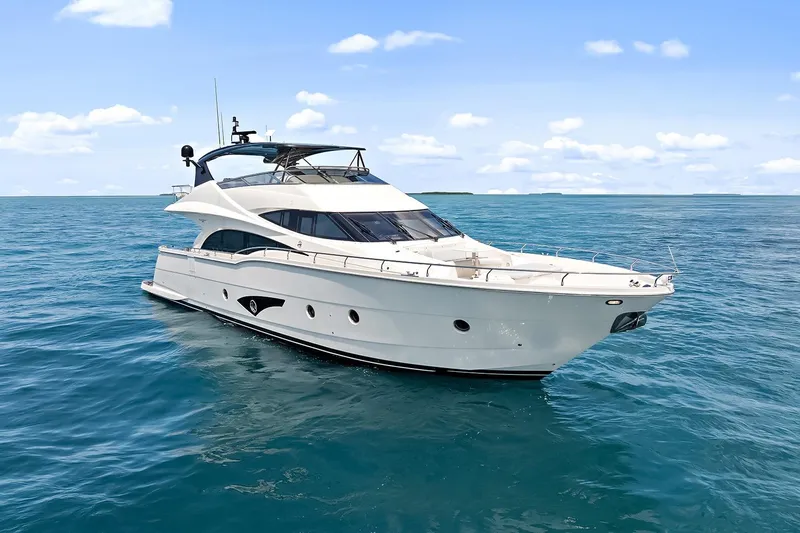  Yacht Photos Pics Luxury 2016 Marquis 720 Fly Bridge yacht cruising on open sea.