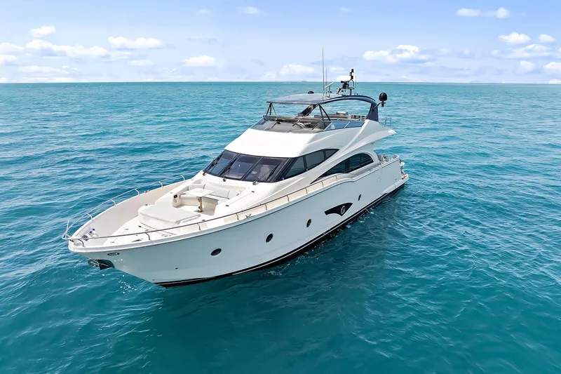  Yacht Photos Pics Luxury 2016 Marquis 720 Fly Bridge yacht cruising on open sea.