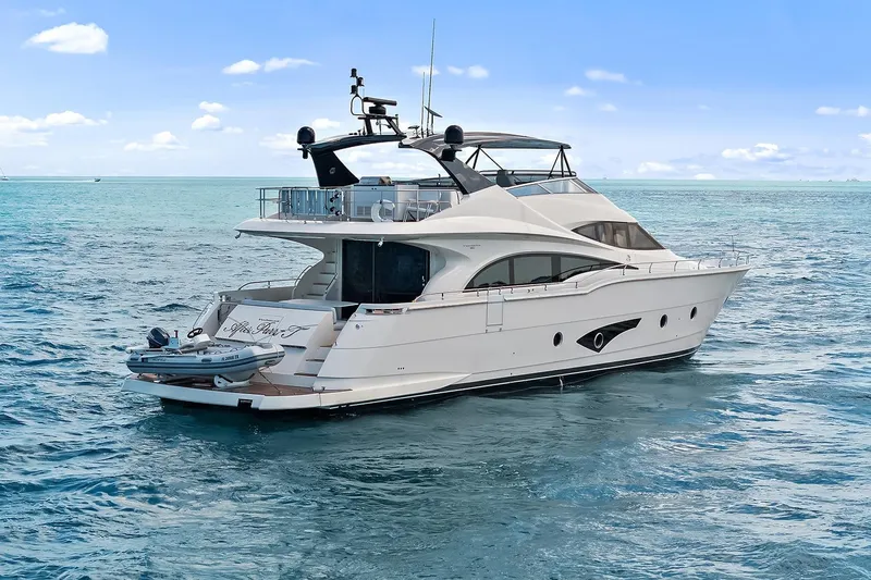  Yacht Photos Pics Luxury 2016 Marquis 720 Fly Bridge yacht cruising on open sea.