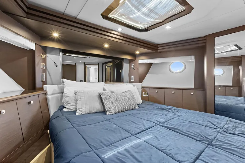  Yacht Photos Pics Luxurious bedroom interior of 2016 Marquis 720 Fly Bridge yacht with modern design.