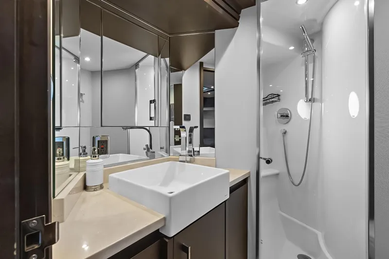  Yacht Photos Pics Luxurious VIP suite bathroom in 2016 Marquis 720 Fly Bridge yacht with modern fixtures.
