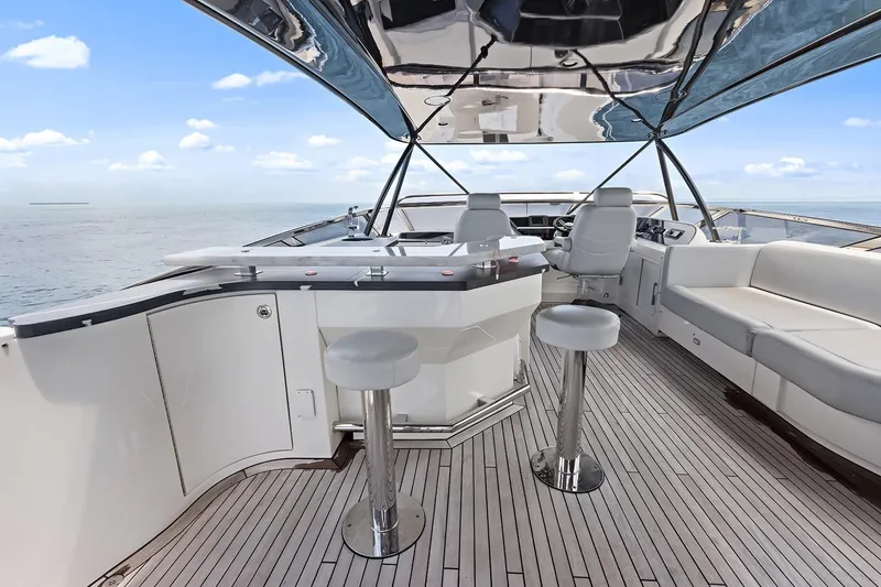  Yacht Photos Pics Luxurious 2016 Marquis 720 Fly Bridge yacht interior with sleek seating and ocean view.