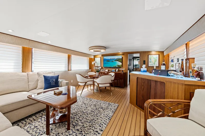  Yacht Photos Pics Luxurious interior of 1989 Hatteras 70 Motor Yacht with modern furnishings and wooden accents.
