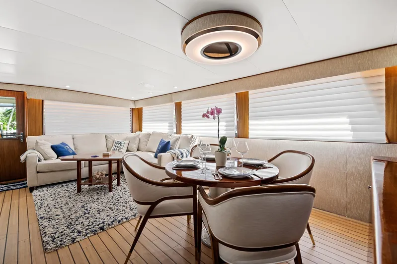  Yacht Photos Pics Luxurious interior of 1989 Hatteras 70 Motor Yacht with elegant dining and seating areas.