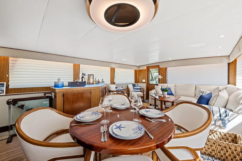  Yacht Photos Pics Luxurious interior of 1989 Hatteras 70 Motor Yacht with elegant dining area.