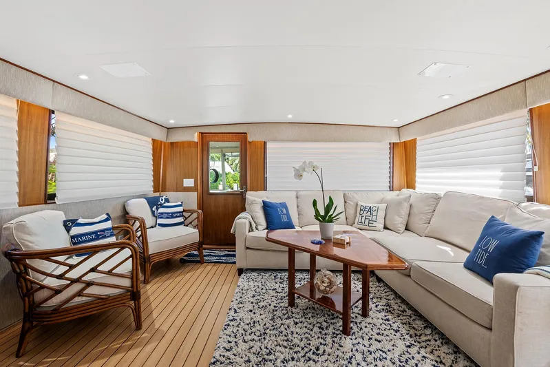  Yacht Photos Pics Luxurious interior of 1989 Hatteras 70 Motor Yacht with cozy seating and nautical decor.