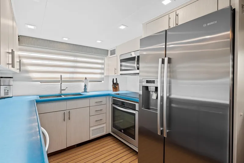  Yacht Photos Pics Modern kitchen in 1989 Hatteras 70 Motor Yacht with stainless steel appliances.