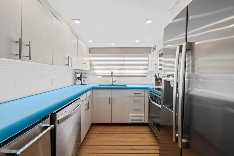  Yacht Photos Pics Modern kitchen in a 1989 Hatteras 70 Motor Yacht with stainless steel appliances.