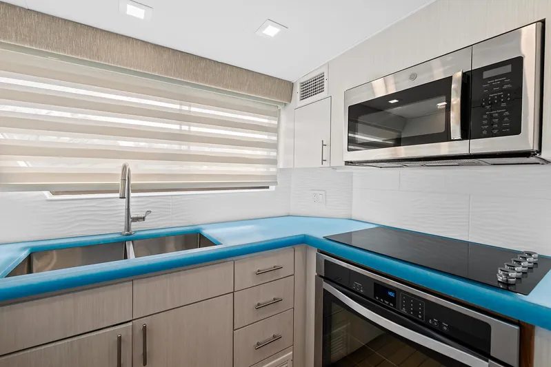  Yacht Photos Pics Modern kitchen in 1989 Hatteras 70 Motor Yacht with stainless steel appliances.