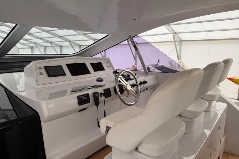  Yacht Photos Pics Luxury yacht cockpit with modern controls and plush seating, Zeta Elle 20, 2023 model.