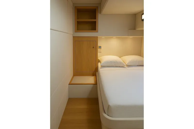  Yacht Photos Pics Modern bedroom interior in Zeta Elle 20 yacht, 2023 model, featuring minimalist design and wooden accents.