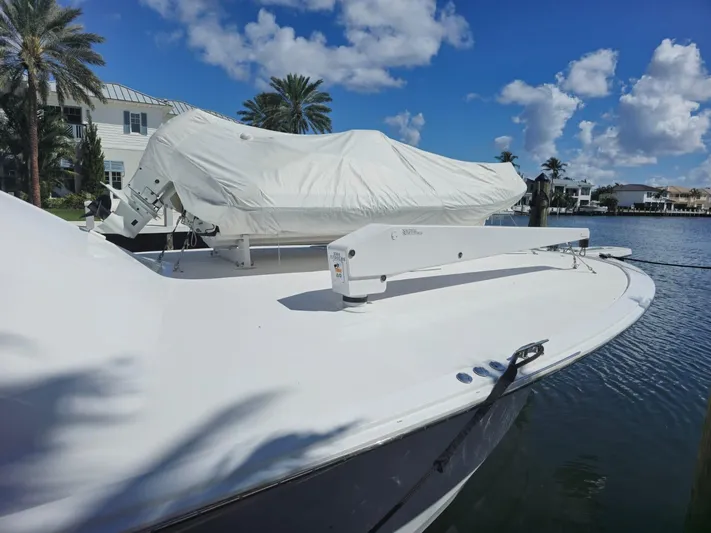 Cast Away Yacht Photos Pics 2008 Hatteras 68 Convertible yacht docked under a clear blue sky.