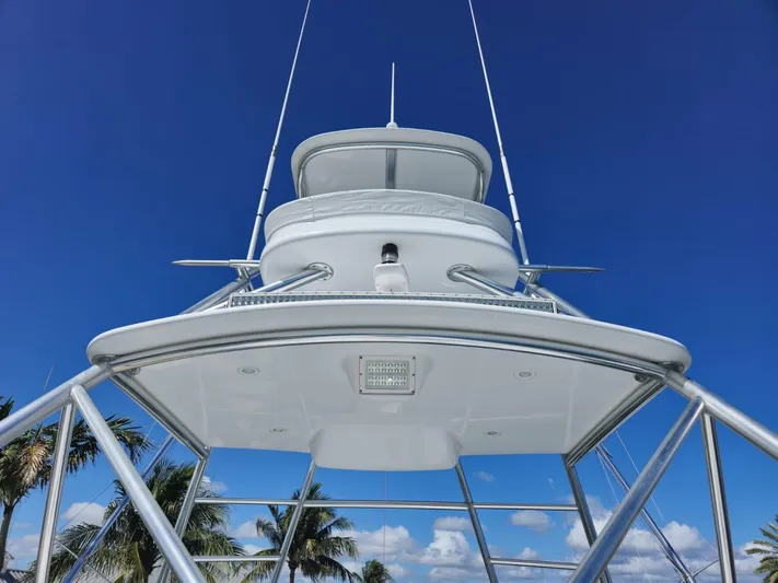 Cast Away Yacht Photos Pics 2008 Hatteras 68 Convertible yacht tower against clear blue sky.