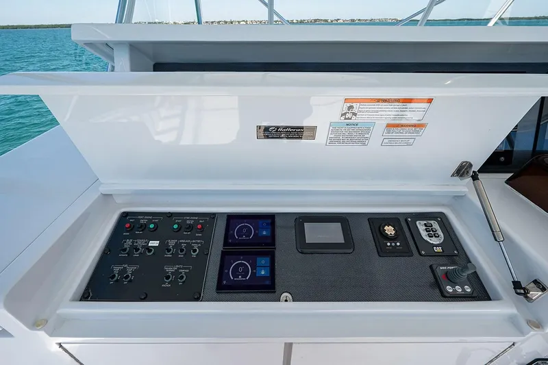 Cast Away Yacht Photos Pics Control panel of a 2008 Hatteras 68 Convertible yacht with various instruments.