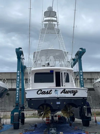 Cast Away Yacht Photos Pics 2008 Hatteras 68 Convertible yacht in dry dock, named "Cast Away."