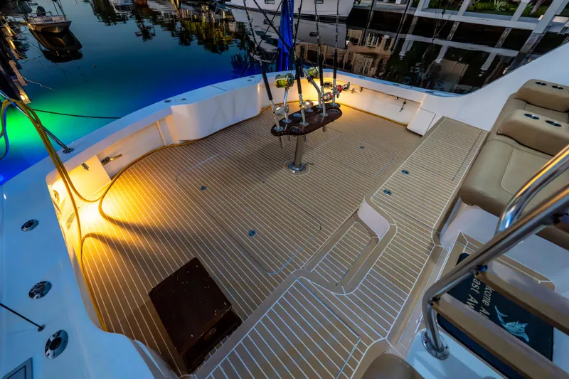Cast Away Yacht Photos Pics Luxurious deck of 2008 Hatteras 68 Convertible yacht, illuminated at dusk.