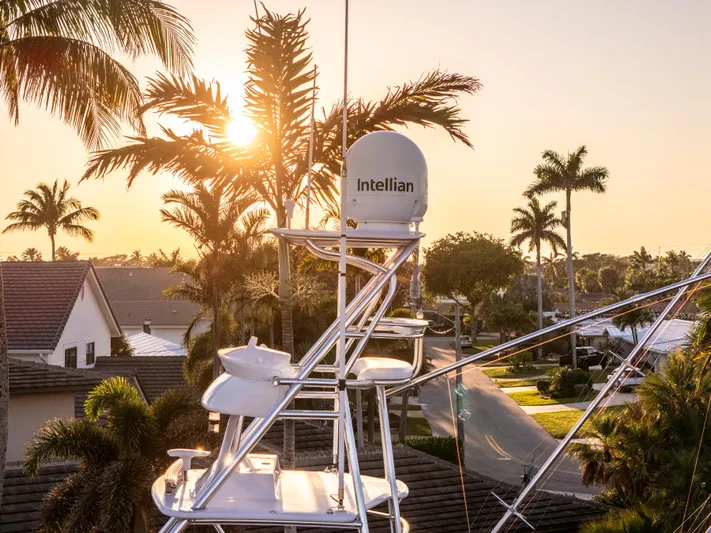 Cast Away Yacht Photos Pics Sunset view from 2008 Hatteras 68 Convertible yacht with Intellian satellite dish.