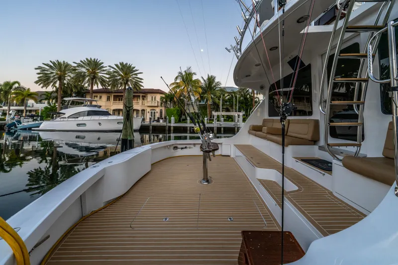 Cast Away Yacht Photos Pics 2008 Hatteras 68 Convertible yacht docked, featuring spacious deck and luxurious seating.