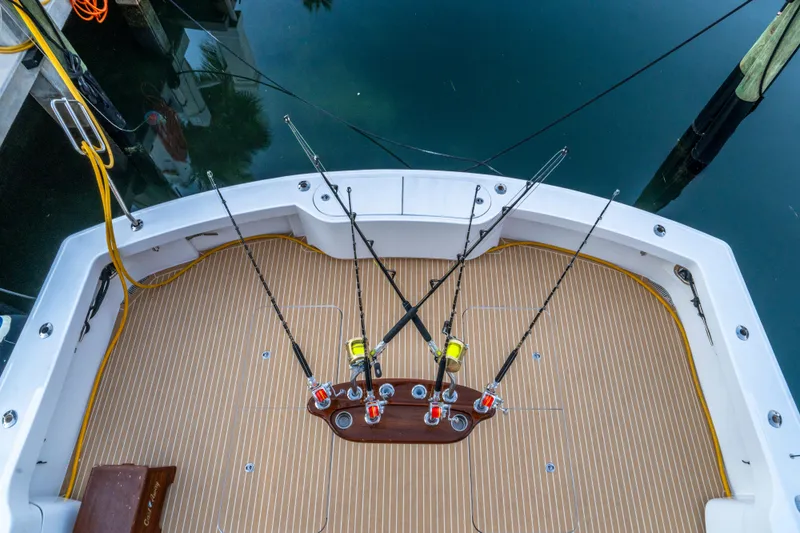 Cast Away Yacht Photos Pics Fishing deck of 2008 Hatteras 68 Convertible yacht with rods and teak flooring.
