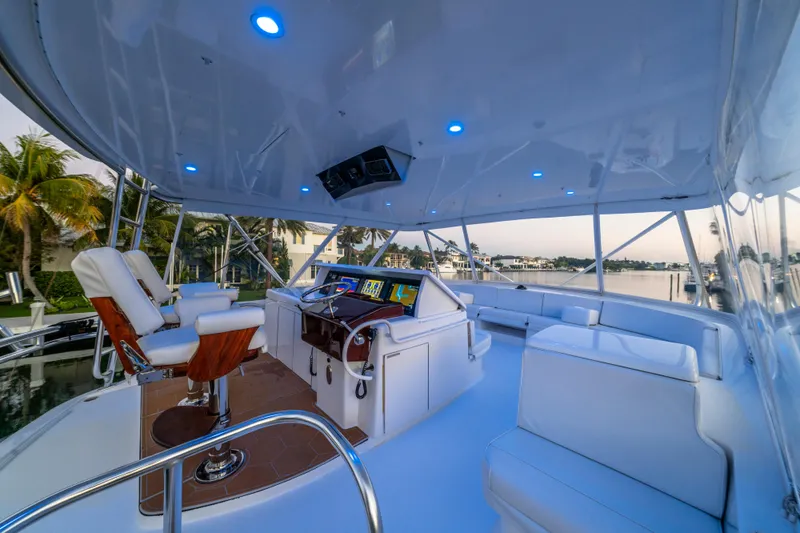 Cast Away Yacht Photos Pics Luxurious 2008 Hatteras 68 Convertible yacht interior with modern helm and seating.