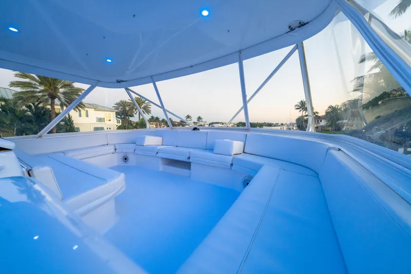 Cast Away Yacht Photos Pics Luxurious seating area on 2008 Hatteras 68 Convertible yacht, with scenic views.