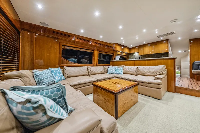 Cast Away Yacht Photos Pics Luxurious interior of 2008 Hatteras 68 Convertible yacht with plush seating and elegant decor.