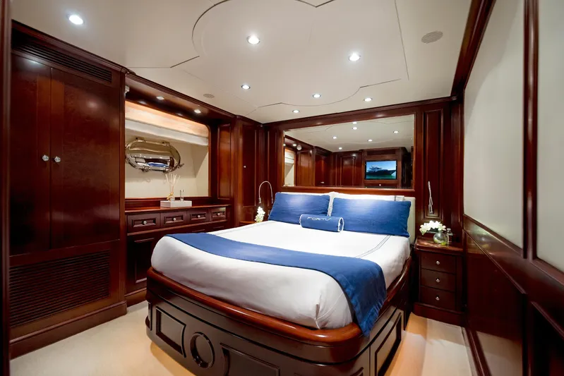 Fortis Benetti 115 Classic Yacht Photos Pics Luxurious bedroom interior on 2003 Benetti 115 Classic yacht with elegant wood finishes.