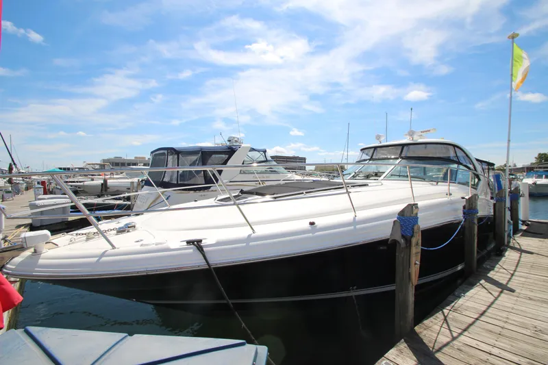  Yacht Photos Pics 2008 Sea Ray 44 Sundancer yacht docked at marina under blue sky.