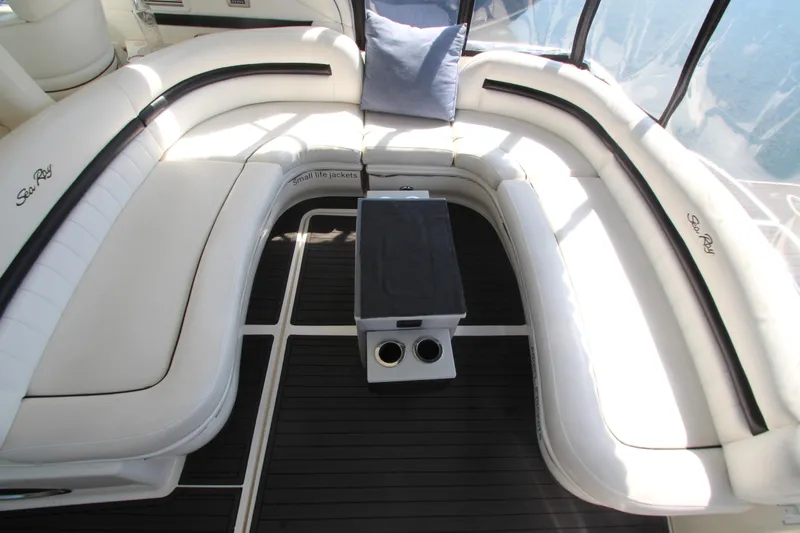  Yacht Photos Pics Luxurious seating area on 2008 Sea Ray 44 Sundancer yacht with white cushions and table.