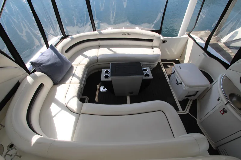  Yacht Photos Pics Luxurious 2008 Sea Ray 44 Sundancer yacht interior with plush seating and table.
