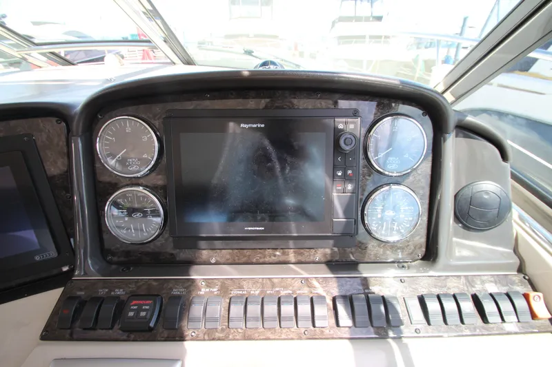  Yacht Photos Pics Dashboard of a 2008 Sea Ray 44 Sundancer with gauges and Raymarine display.