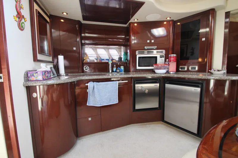  Yacht Photos Pics Luxurious kitchen interior of 2008 Sea Ray 44 Sundancer yacht with modern appliances.