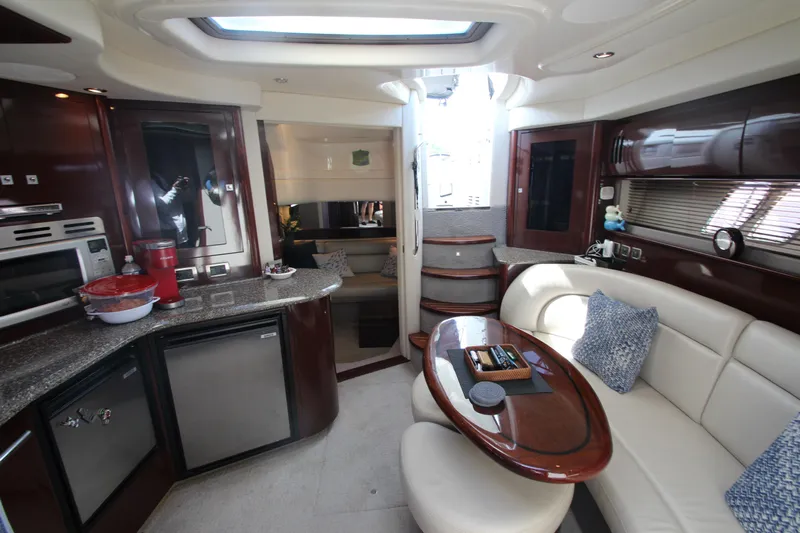  Yacht Photos Pics Luxurious interior of 2008 Sea Ray 44 Sundancer yacht with modern kitchen and seating area.