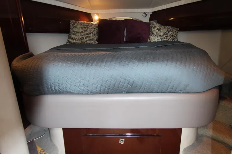  Yacht Photos Pics Luxurious cabin interior of 2008 Sea Ray 44 Sundancer with cozy bedding.