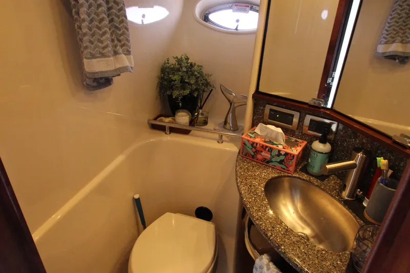  Yacht Photos Pics Luxurious 2008 Sea Ray 44 Sundancer bathroom with modern amenities and elegant design.