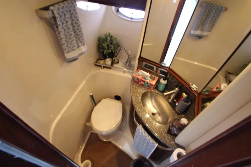  Yacht Photos Pics 2008 Sea Ray 44 Sundancer bathroom with sink, toilet, and mirror.
