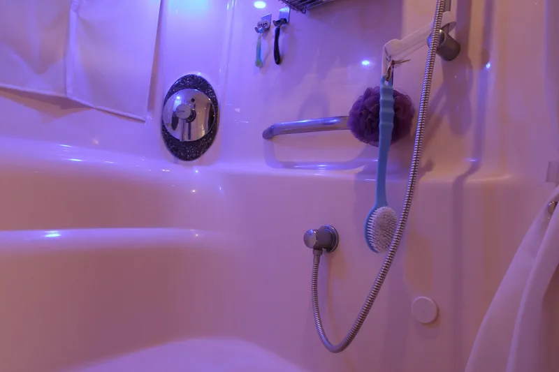  Yacht Photos Pics Luxurious bathroom in 2008 Sea Ray 44 Sundancer yacht with modern fixtures and ambient lighting.