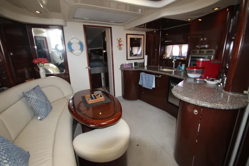  Yacht Photos Pics Luxurious interior of 2008 Sea Ray 44 Sundancer yacht with elegant seating and modern kitchen.