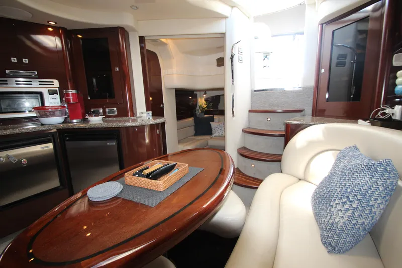  Yacht Photos Pics Luxurious interior of 2008 Sea Ray 44 Sundancer yacht with modern kitchen and seating area.