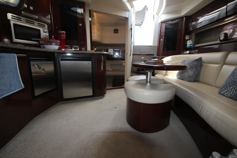  Yacht Photos Pics Luxurious interior of 2008 Sea Ray 44 Sundancer yacht with modern kitchen and seating area.