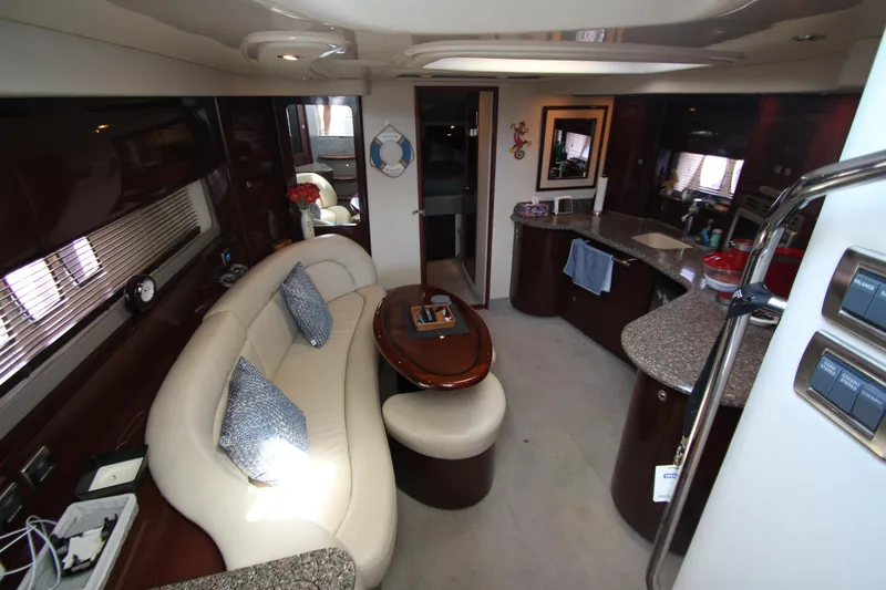  Yacht Photos Pics Luxurious interior of 2008 Sea Ray 44 Sundancer yacht with elegant seating and modern kitchen.
