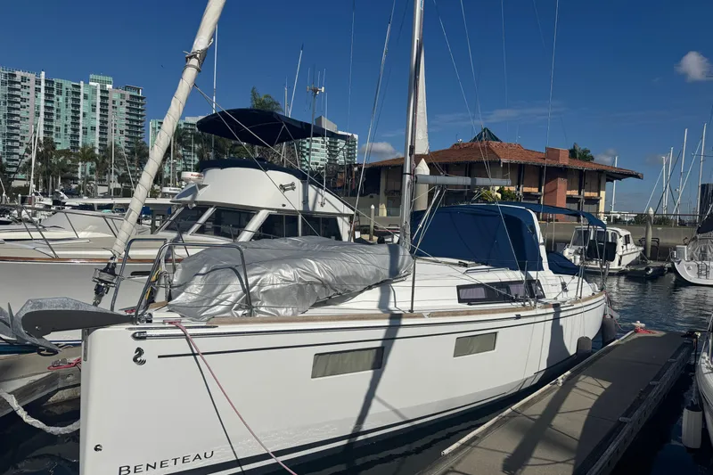 Viento Yacht Photos Pics 2018 Beneteau Oceanis 35.1 sailboat docked at marina with cityscape background.