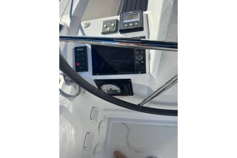 Viento Yacht Photos Pics Cockpit controls of a 2018 Beneteau Oceanis 35.1 sailboat, featuring navigation instruments.