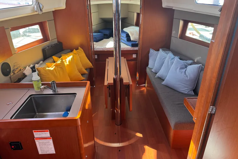 Viento Yacht Photos Pics Interior of 2018 Beneteau Oceanis 35.1 sailboat with cozy seating and modern kitchen area.