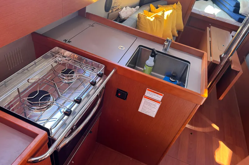 Viento Yacht Photos Pics Interior of 2018 Beneteau Oceanis 35.1 yacht kitchen with stove and sink.